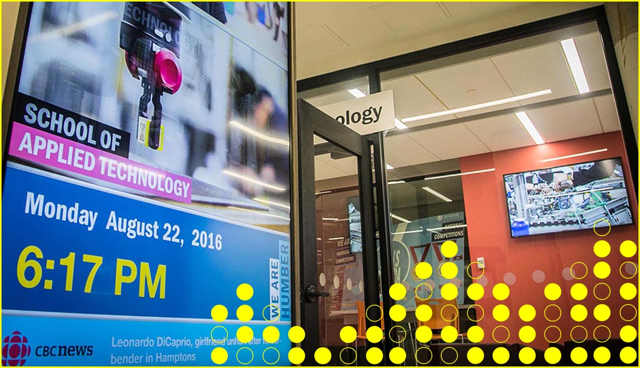 digital screens in education facility lobby