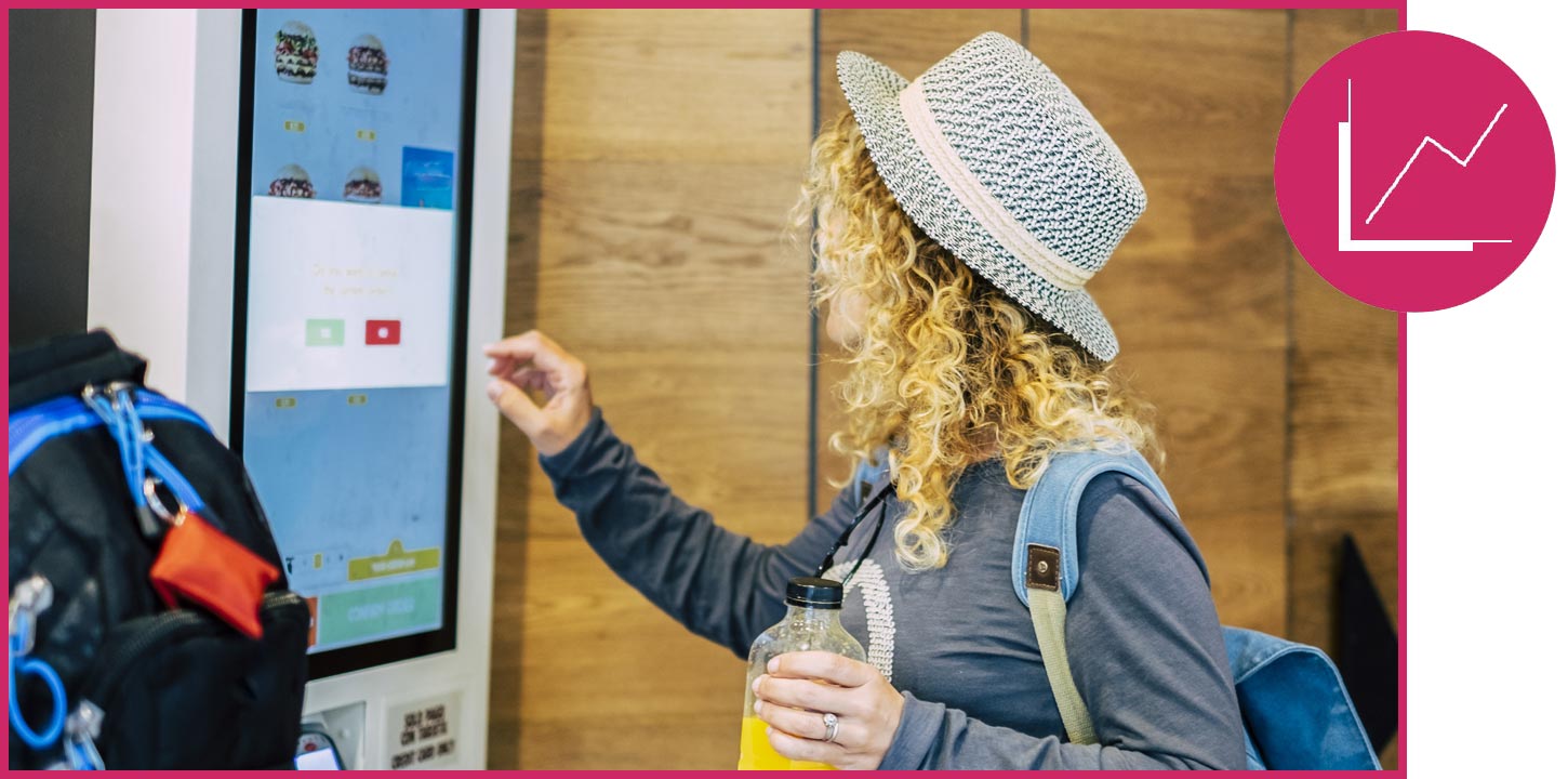 woman on phone stock market screens