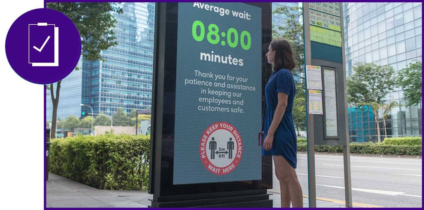 woman on phone stock market screens
