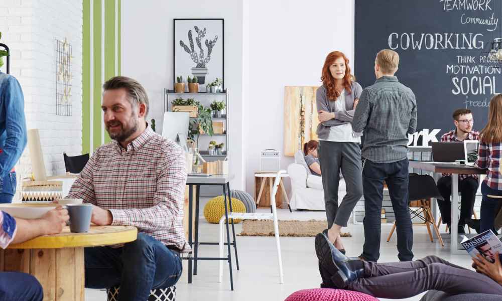 employees engaging in discussion in office setting