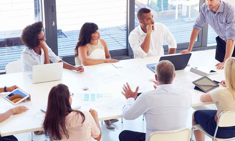 group of people sitting around table