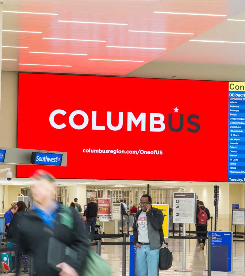 Large digital screen with arrival and departure information in airport