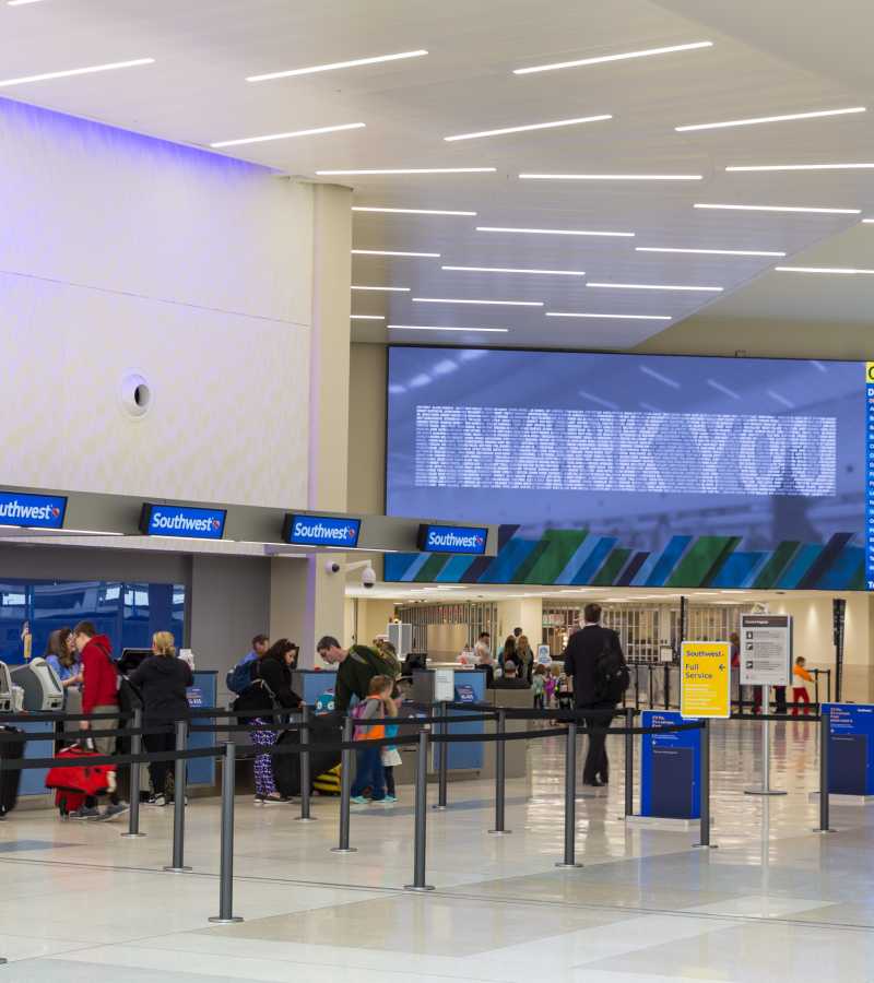 Large digital screen with arrival and departure information in airport