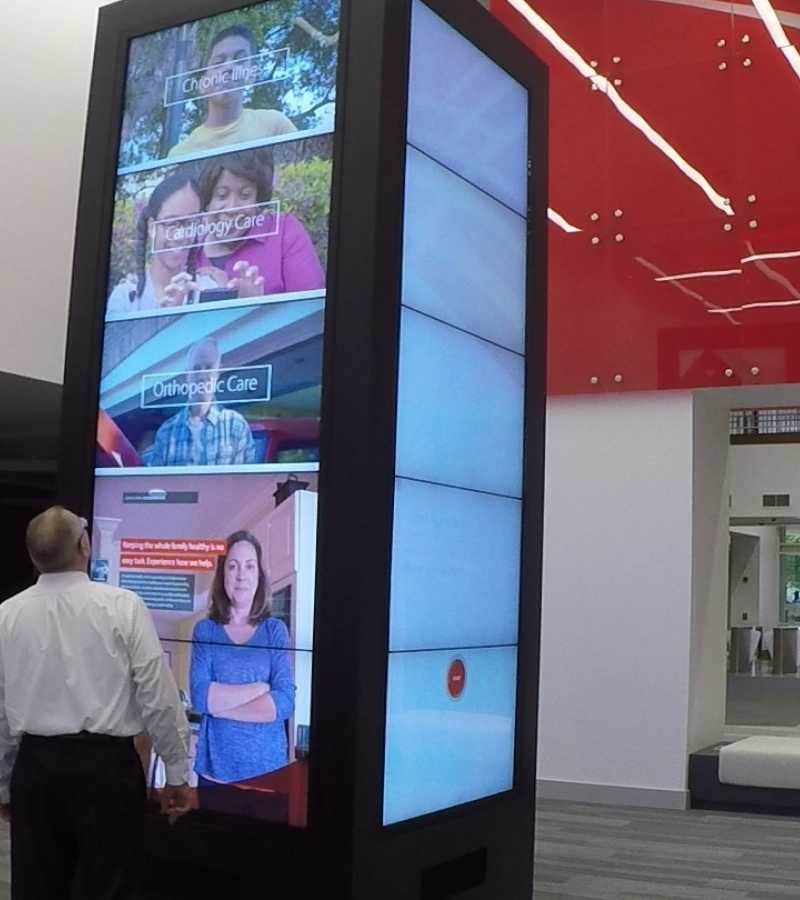 digital screens in vertical video wall in corporate lobby